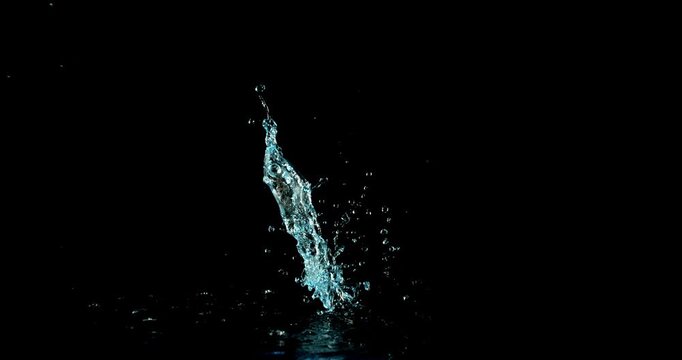 Super slow motion (1000 fps) vertical water splash with dynamic upward motion, isolated on black background. Clean liquid effect with droplets, ideal VFX overlay for product scenes.
