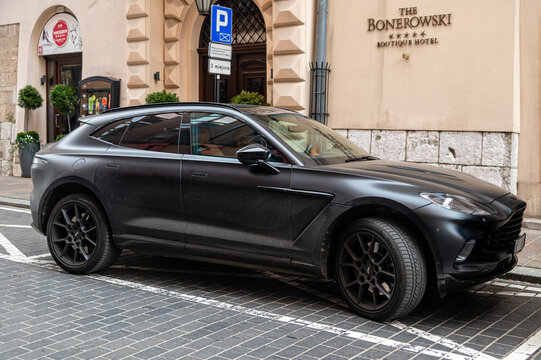 Luxury Aston Martin DBX parked in Krakow, Poland near the Bonerowski Boutique Hotel