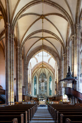 Fototapeta premium Grand Vaulted Nave Showing Distant Altar Stone Columns