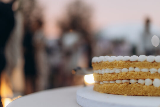 Layered cake on display at outdoor celebration