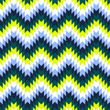 Seamless geometric chevron zigzag tribal pattern with blue green and yellow colors