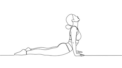 Fototapeta premium Continuous line drawing of a woman in cobra yoga pose on a mat indoors