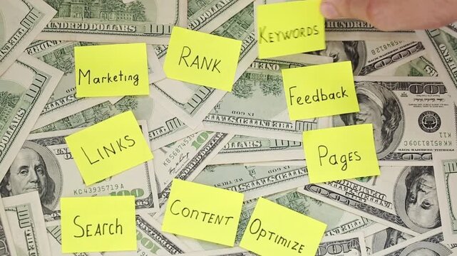 A lot of dollar bills and various notes, internet optimization, SEO optimization notes