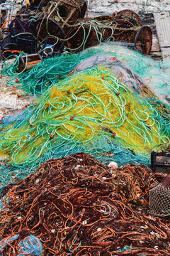 Fishing nets and traps stacked in a fishing port
