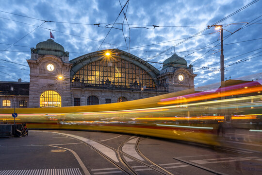 Tram in motion at Basel main station in Switzerland at evening