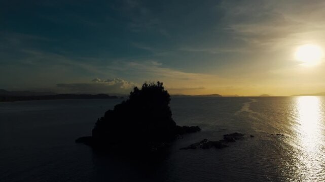 4K Drone shot around island during golden hour (sunset)