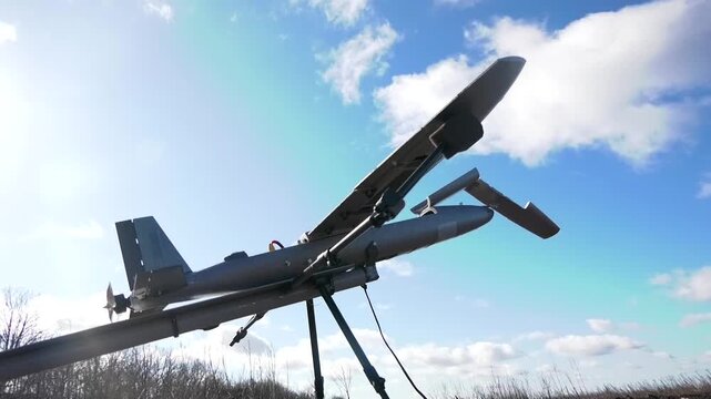 Medium-range strike drone before launching in the field. The concept of modern warfare, unmanned aerial vehicles and intended use during active hostilities. Military technology, battlefield operations