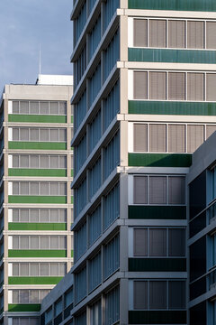 Urban architecture detail of modern building facade with windows showing symmetry and stripes pattern for abstract city composition