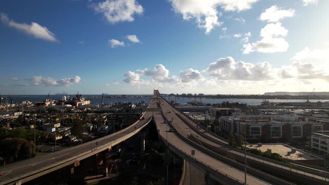Drone flying toward the on ramp leading to the Coronado Bridge at 6PM capturing traffic flow and infrastructure.