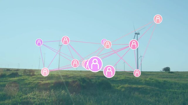 Fading pink purple nodes linking around pulsing node via magenta lines over grassy hill, turbines