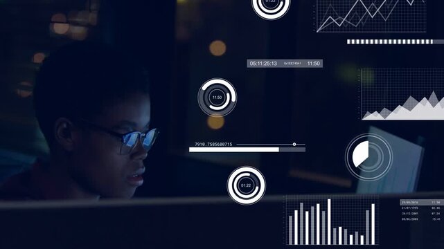 Receiving paper, analyst with glasses, dark top checking screens in office at night analyzing data
