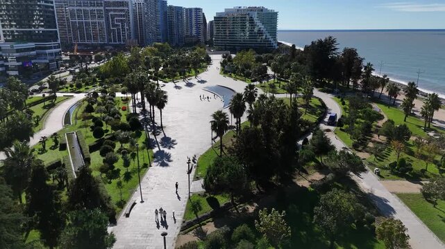 Wide aerial shot of the green recreational zone and walking paths in Batumi, Georgia.