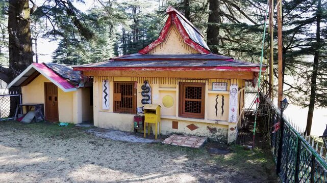 hindu temple building in forest with snake symbols nag temple peaceful spiritual place