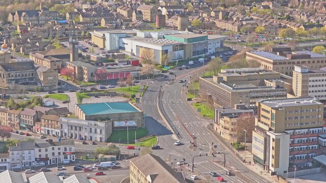 Queensgate A629 and Firth Street junction in Huddersfield Kirklees West Yorkshire England United Kingdom with University of Huddersfield Oastler Building and traffic, static aerial drone shot