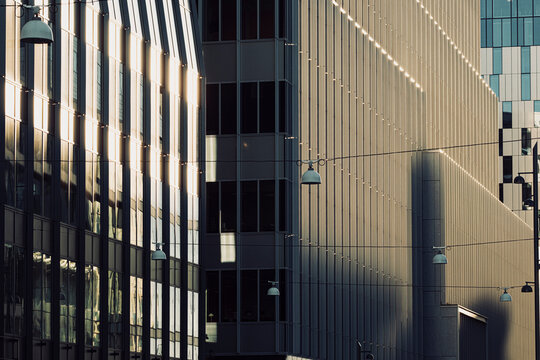 Stockholm Hagastaden urban district reveals modern architecture with facade shadows reflections and strict lines of geometry creating a graphic city mood