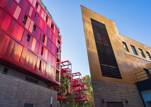 Montpellier, France - 09 30 2023 : Cityscape view of bright red modern architecture of Version Rubis apartment building by Jean-Paul Viguier