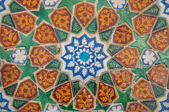 Closeup detail view of ancient colorful ceramic tiles floral motif on wall of Makhdum Nuh tomb, Hala, Sindh, Pakistan
