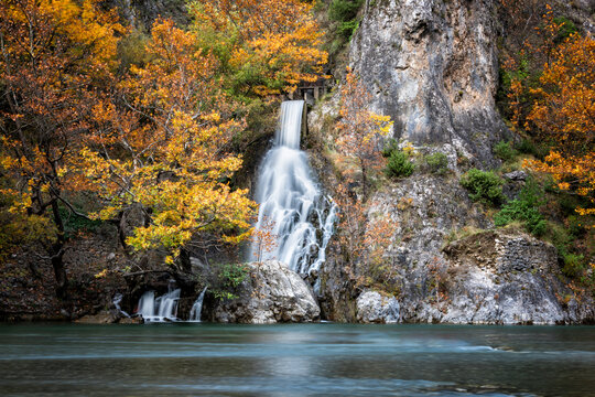Konitsa Waterfall with autumn colors (col) - A small waterfall running through colorful trees and rocks 