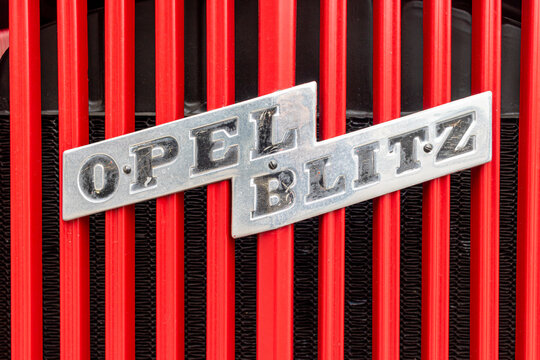 The Opel Blitz logo on the grille of an old truck. These trucks were manufactured by the German company Opel from the 1930s to the 1970s.