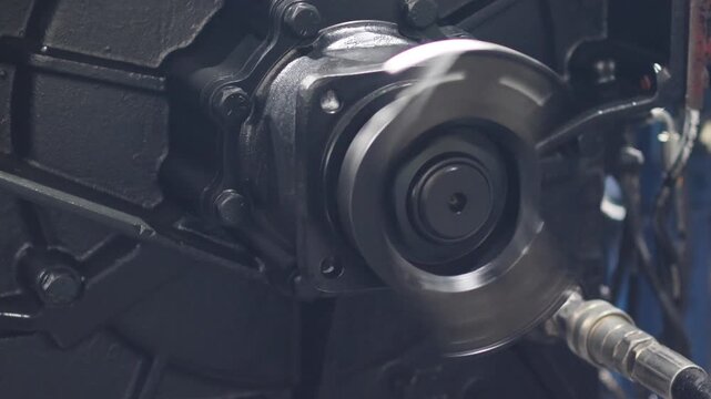 Close up of a heavy duty industrial transmission output shaft spinning rapidly during a performance test. Mechanical power transfer and engineering concept.