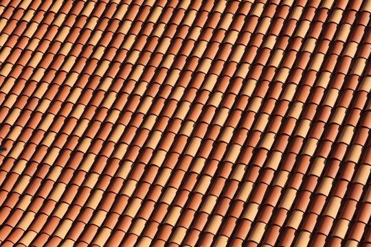 New terracotta fired clay roof tiles in Dubrovnik, Croatia. Mediterran style orange red tiled roof.
