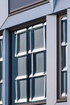 Modern building facade with window corner frame reveals geometry and pattern in minimalism architecture creating an abstract structured look