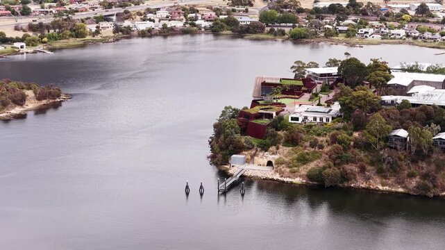Mid air panorama of Derwent river headland Mona contemporary architecture buildings.