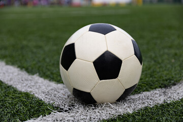 Fototapeta premium Soccer ball on soccer field
