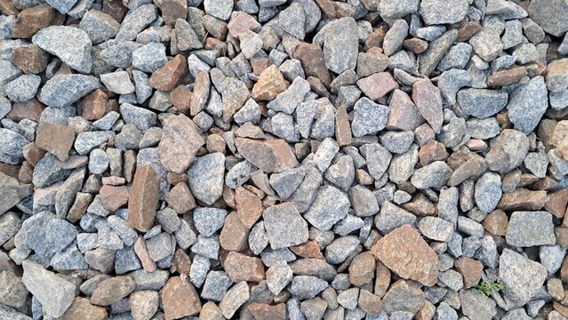 Mixed gravel texture background, natural stone surface top view