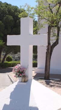 Whitewashed white cross on the door of an Andalusian hermitage, Tilt