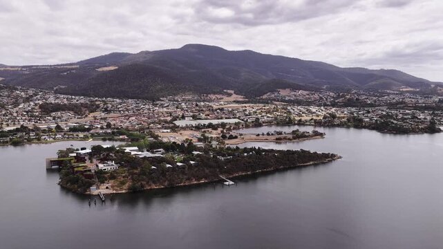 Wide aerial panorama over Derwent river in Hobart from MONA to city waterfront.
