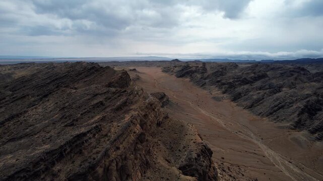 Aerial Of Rugged Strata Patterns In Mongolian Gobi, Noyon Uul, Mongolia