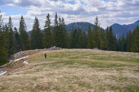 Man flying drone on alpine meadow