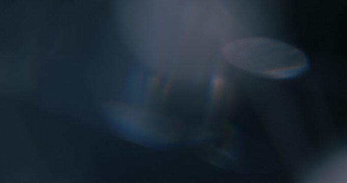 Discover captivating abstract light reflections captured with prisms, ideal for enhancing motion graphics and visual effects in creative projects, offering stunning backdrops and bokeh effects