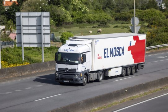 Pontevedra, spain; 04 10 2026 cargo truck with el mosca branding driving on highway
