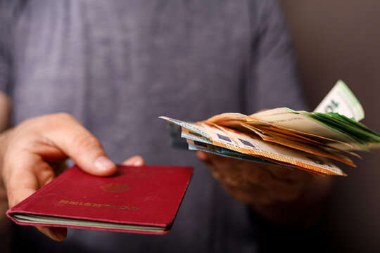 Person holding passport and euros. Concept of travel, finance, wealth, business and vacat