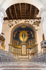 Fototapeta premium SALERNO, ITALY - OCTOBER 6, 2025: The presbytery with mosaic of St. Assumption and sanits in the apse of Cathedral of St. Matthew by workroom from Ravenna (1950 - 1950).