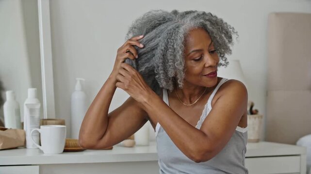 Confident Senior African American Woman Embracing Natural Silver Curls with Grace and Beauty, Gently