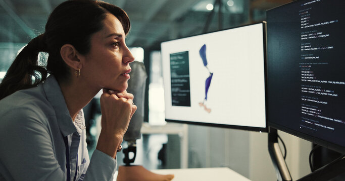 Woman, thinking and developer with design for prosthetic leg, programming or 3D printing in lab. Thoughtful, female person or biomedical engineer contemplating on computer for artificial development