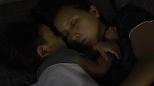 Mom And Child Nap Together, A peaceful ad film of mom and child napping together, soft sunlight wrapping their cozy embrace, perfect for a family commercial or tender lullaby documentary.