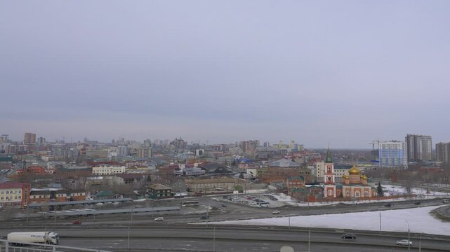March 22 2026 Barnaul Russia aerial view of city with Old Bazaar and Znamensky Cathedral covered in snow cold early spring urban cityscape and winter atmosphere.