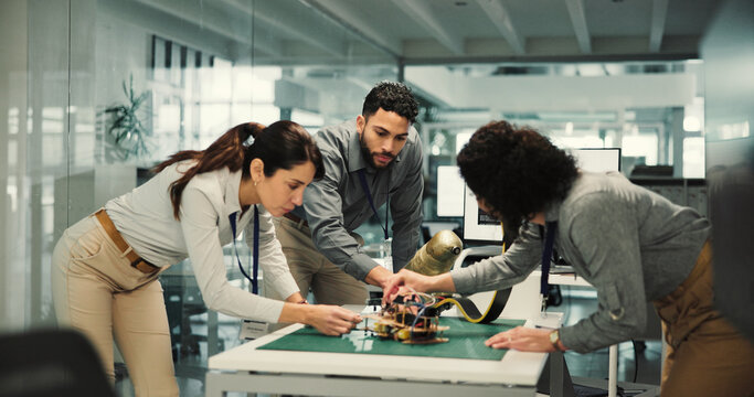 Team, engineering and robotics with business people in office for mechatronics, meeting and programming. Collaboration, prototypes and planning with employees for system function and project