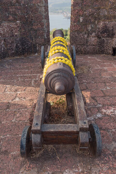 Ancient cannon at Bankot Fort or Himmatgad Fort or Fort Victoria, Velas, Maharashtra, India.