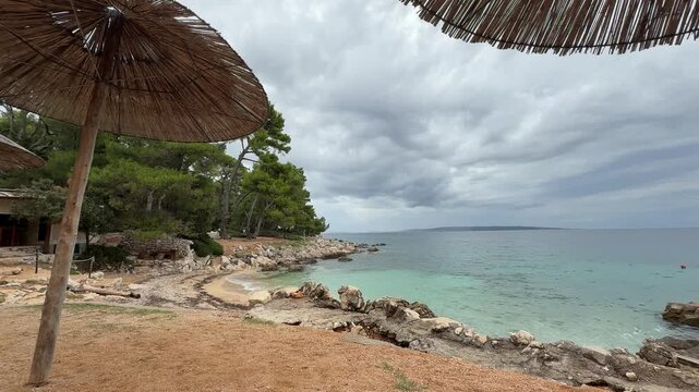 Tropical beach with turquoise water and lush greenery on Rab Island Croatia