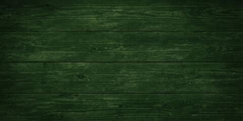 A dark green grunge wood texture featuring a vintage aged pattern on a rough wooden plank surface for a weathered material backdrop © hossain