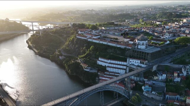 Flying over Porto Portugal at golden hour showing Douro River and Dom Luis I Bridge