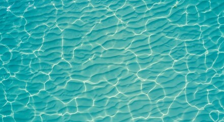 Obraz premium Calm Turquoise Water Surface with Gentle Ripples and Sunlit Patterns, Ideal for Summer Serenity and Relaxation