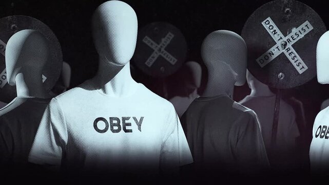 A group of faceless spinning mannequins and political statements contained on street signs on an endless loop.
