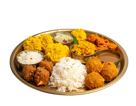 Chhath puja thali with coconut oil, rice, sweets and bhog items on brass plate