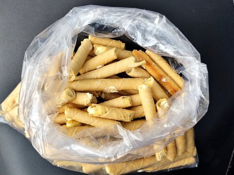 A clear plastic bag contained a large quantity of semprong, or egg roll, cakes